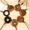 Round wooden ethnic sweater necklace with vintage clock pendant, adding retro charm to any outfit.