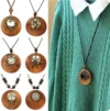 Round wooden ethnic sweater necklace with vintage clock pendant, adding retro charm to any outfit.